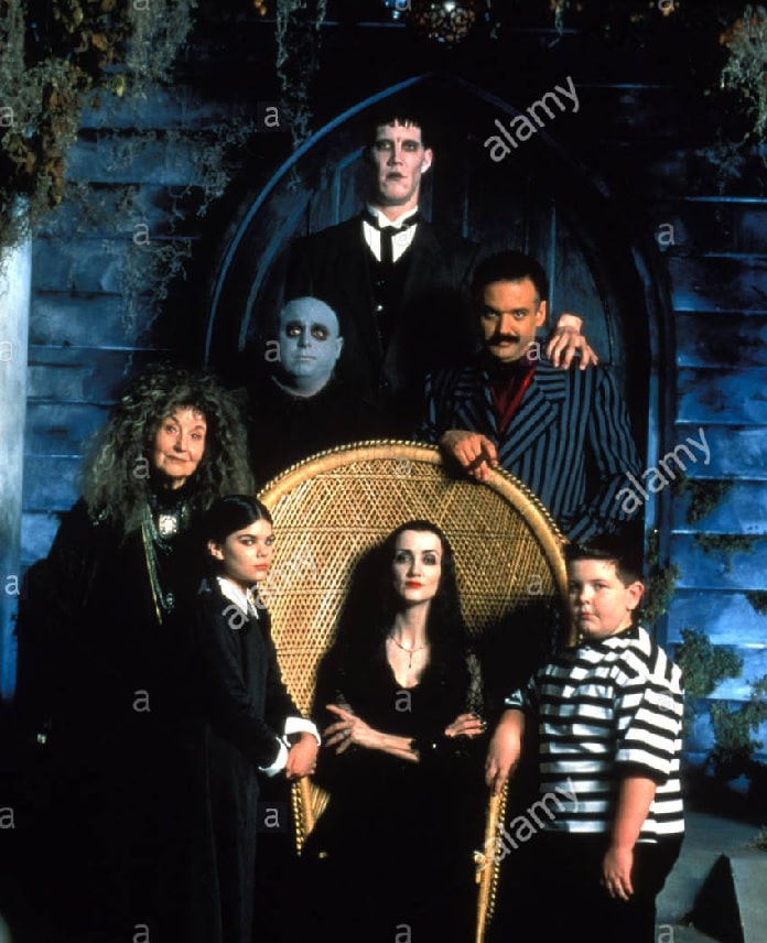 John DeSantis standing as a zombie with his other co-stars for the cover photo of the series The New Addams Family